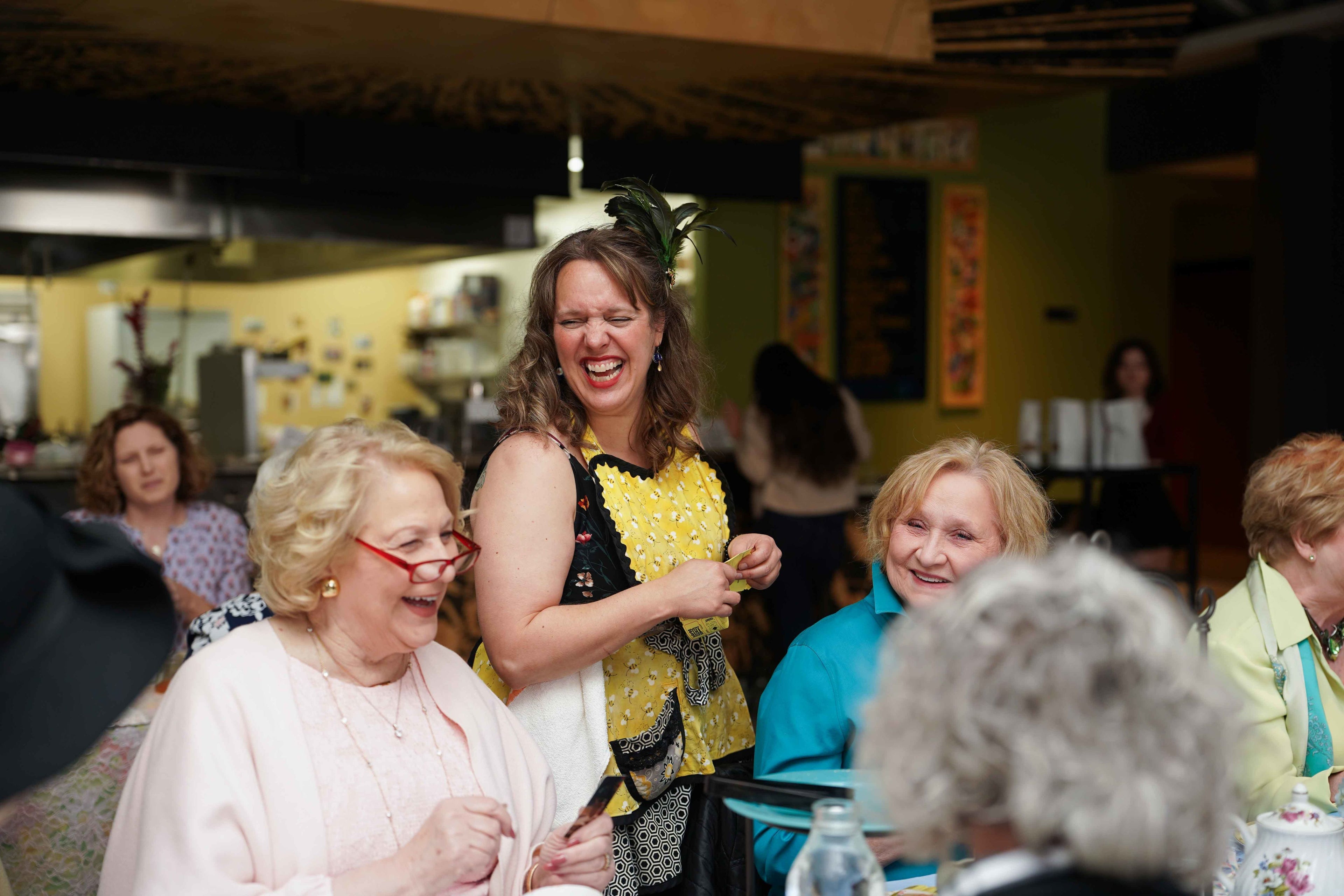 Group of women laughing together in a social setting